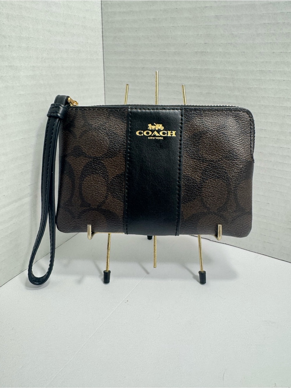 Coach Corner Zip Wristlet In Signature Canvas And Stripe, Brown/Black Leather